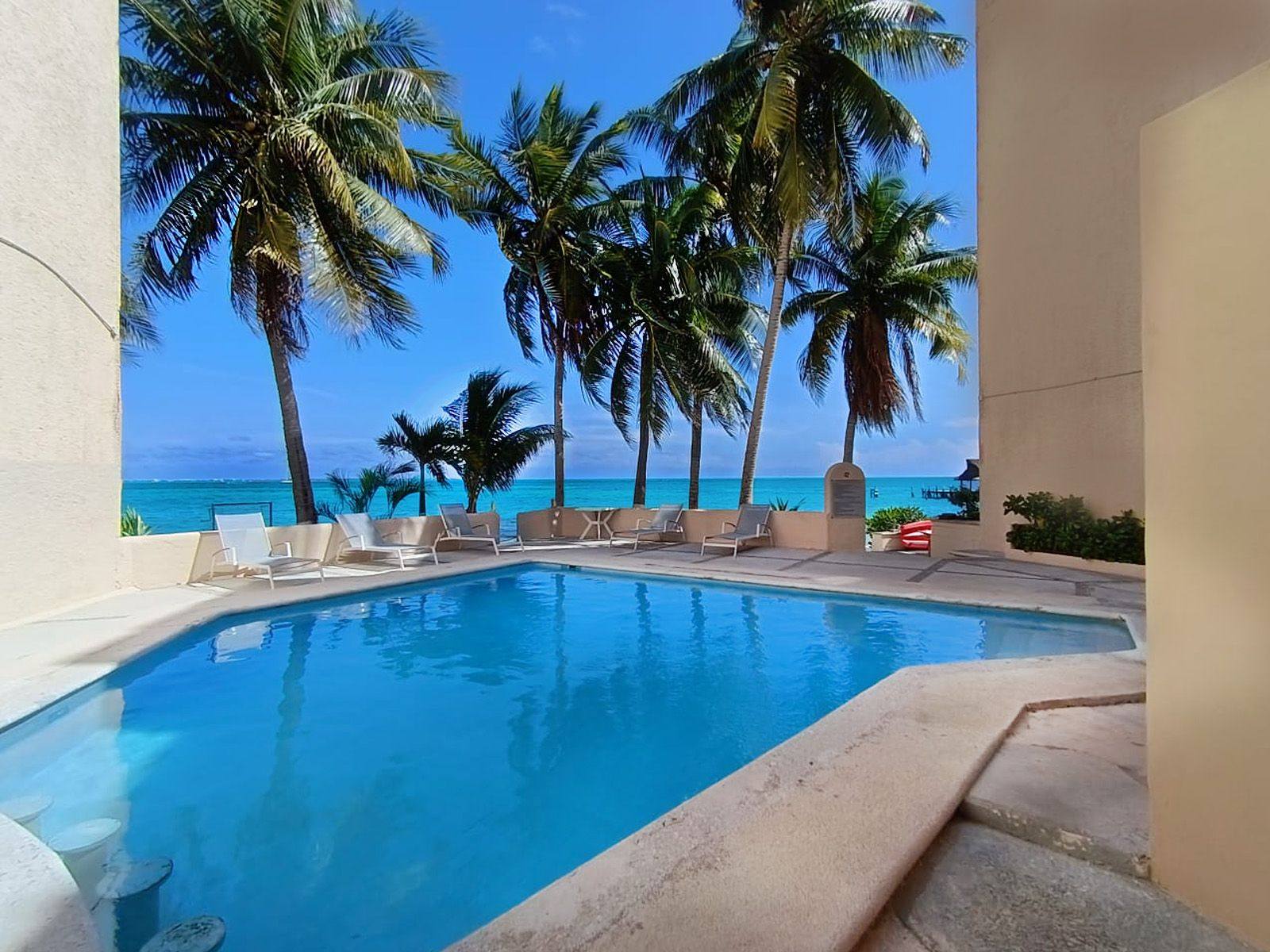 Departamento en venta, en Cancún, Quintana Roo, 2 recámaras, 2 baños — Departamento Frente al Mar en Venta en Cancún | Oportunidad Única en Puerto Juár (foto 3)